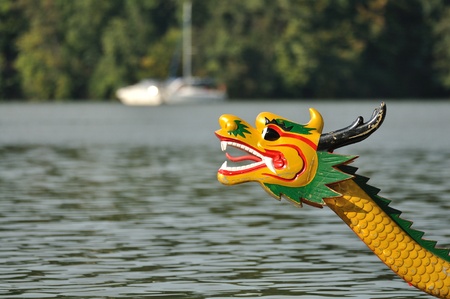 Head of dragon boat on the waterの写真素材