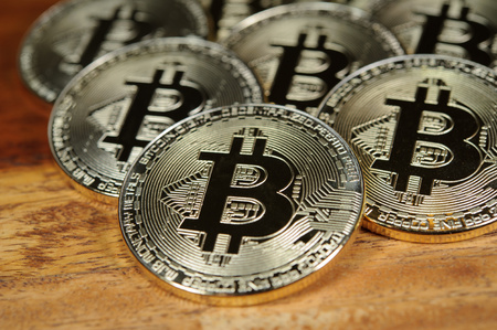 Bitcoins on wooden deskの写真素材