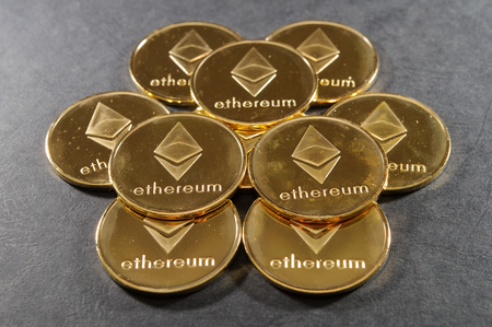 Stack of golden ethereum coins. Cryptocurrency background image.