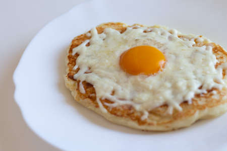 Adjarian khachapuri in a frying pan. Dietary low-calorie khachapuri with cottage cheese dough on a white plate. Proper nutrition. simple breakfastの写真素材
