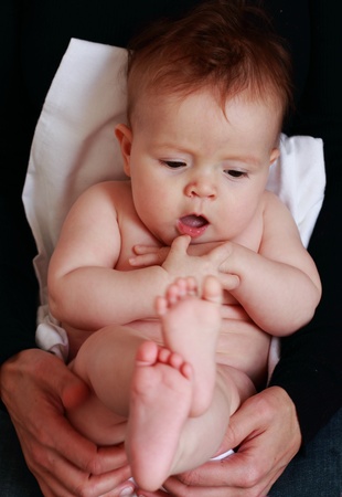little baby-girl sitting on her motherの写真素材