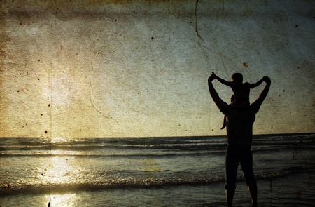 father and son on the sea. Photo in old color image style.の写真素材