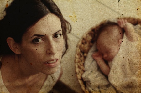 mother with her baby. Photo in old image style.の写真素材