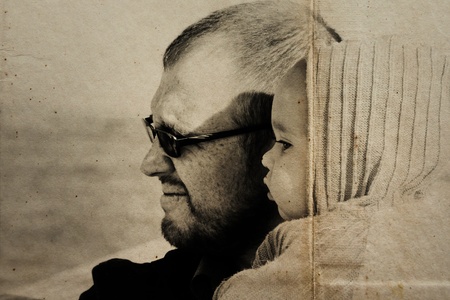portrait of 10 month old girl and dad. Focus on the child.
