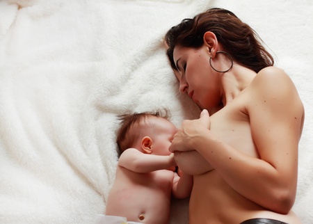 mother feeding babyの写真素材