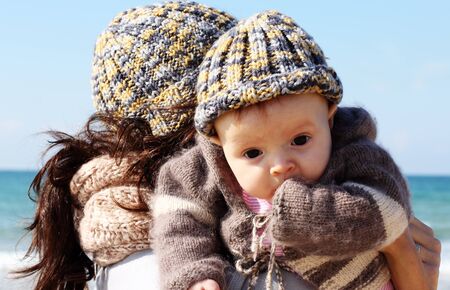 mother with child on the beachの写真素材
