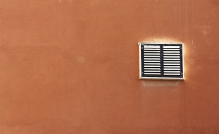 window in an old brown wallの写真素材