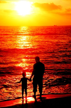 father and son on the seaの写真素材