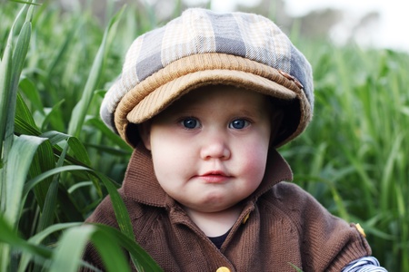 toddler in the green grassの写真素材