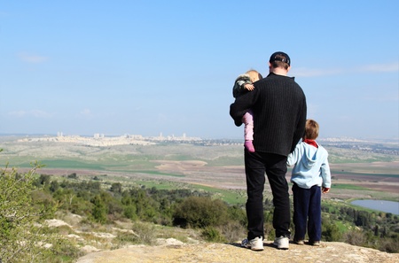 Father hiking with two childrenの写真素材