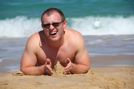 Happy handsome Man on the beach の写真素材