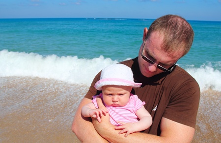 father and daughter  on the beachの写真素材