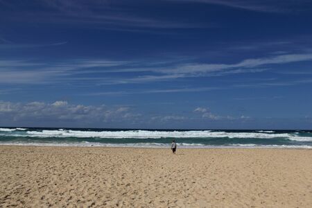 3-year-old looks at the seaの写真素材