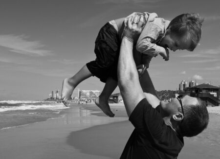 father and son on the seaの写真素材