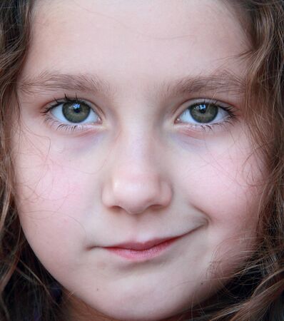 Closeup of a cute small girl の写真素材