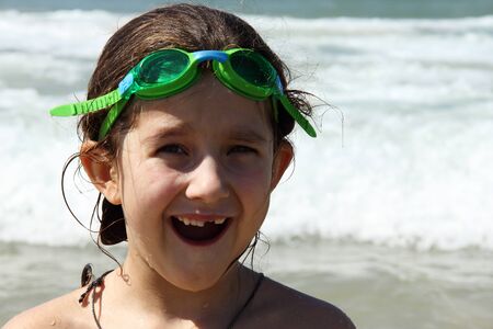  girl laughing in the sea on a sunny day の写真素材