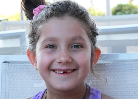 beautiful, funny, a seven-year girl  There is no front teeth の写真素材