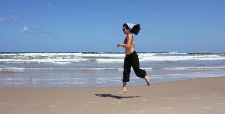 girl running on the beachの写真素材
