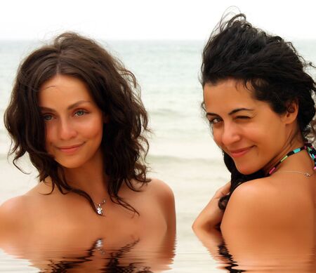 two beautiful girls on the beachの写真素材