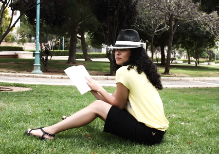 Beautiful young woman with book の写真素材