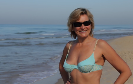 attractive senior woman on the beachの写真素材
