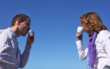young happy couple drinking coffeeの写真素材