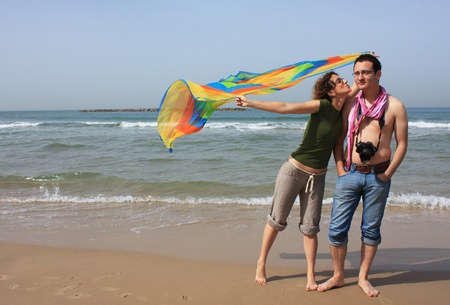 Young happy couple at the beachの写真素材