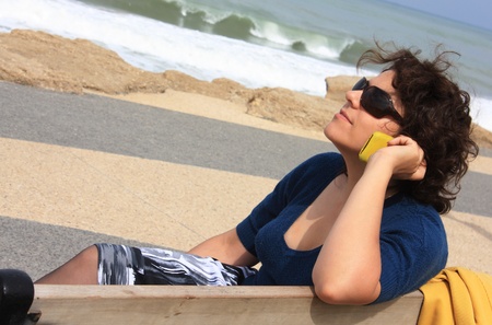 Young beautiful girl on the phone with her boyfriendの写真素材