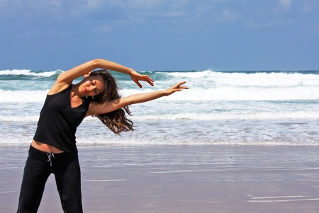 woman on the fitness on the beachの写真素材