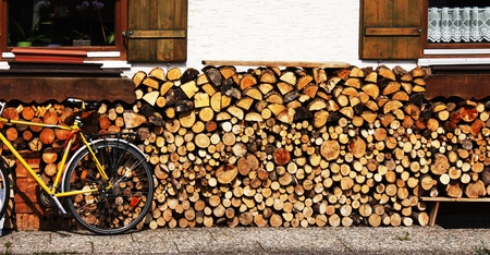 Bike parked in front of a cottageの写真素材