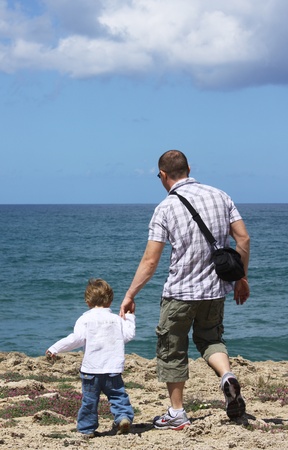 father and son in the sea の写真素材