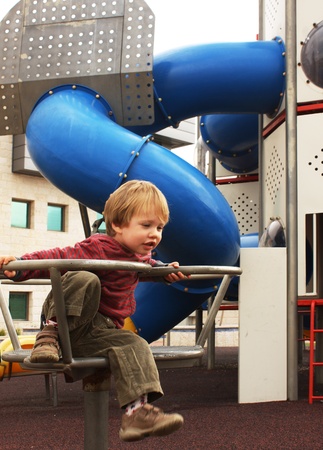 2 year old child on the playgroundの写真素材
