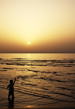 child at sunsetの写真素材