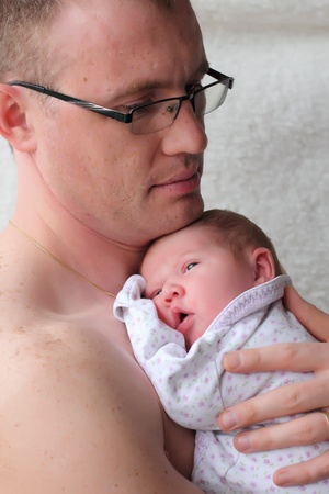 father holds newborn babyの写真素材