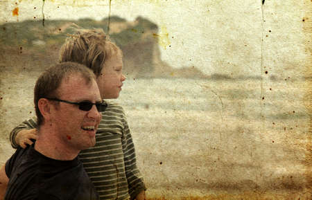 father and son on the beach  Photo in old image style の写真素材