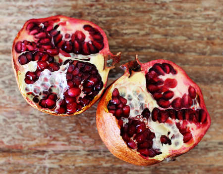 pomegranate fruit on wooden backgroundの写真素材