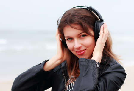 Beautiful girl on the winter beachの写真素材