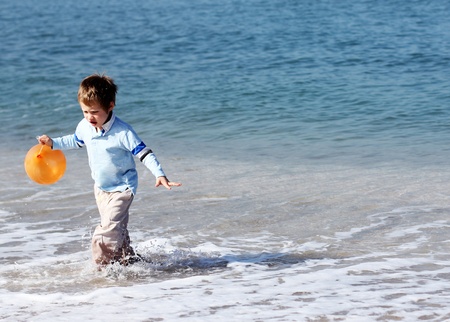 4 years old boy at the seaの写真素材