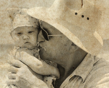 happy grandpa is holding a little granddaughter  Photo in old image style の写真素材