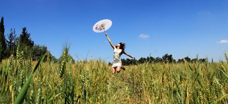 Young woman in the fieldの写真素材