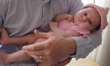father holds newborn babyの写真素材