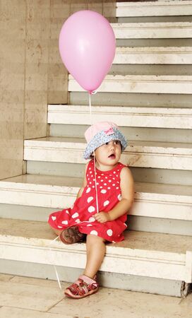 girl in the hat on the stairsの写真素材