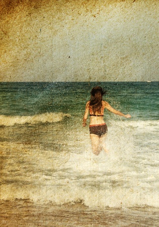 young girl at the sea  Photo in old color image styleの写真素材