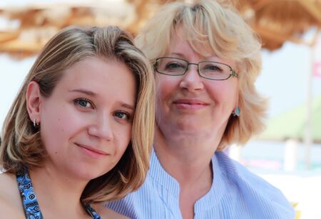 Mother and daughter on vacation at seaの写真素材