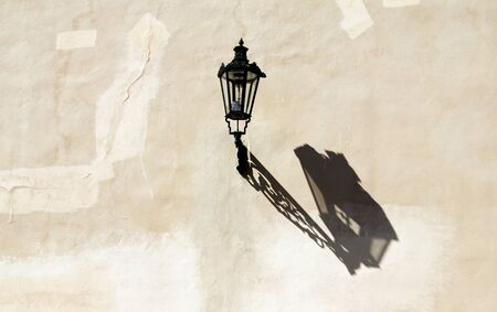 Old street lamp on the wallの写真素材