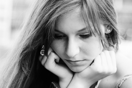 face portrait of sad young girlの写真素材
