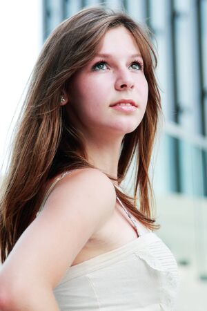 young cute girl looking upの写真素材