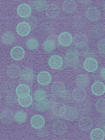 green textured  paper with random large dotsの写真素材