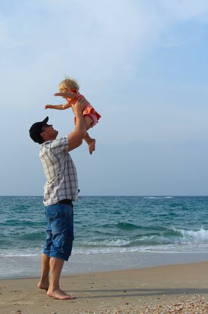 father and daughter on vacation at seaの写真素材