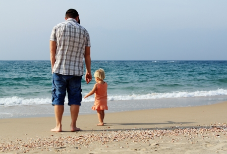 father and daughter on vacation at seaの写真素材